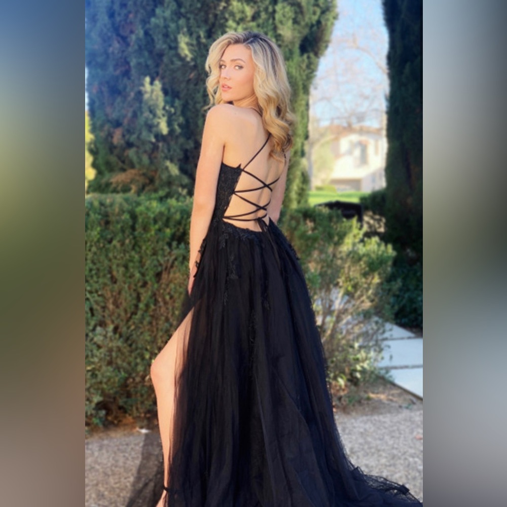 Long black evening gown. Size large. Unworn. Corset top with tulle skirt & slit
